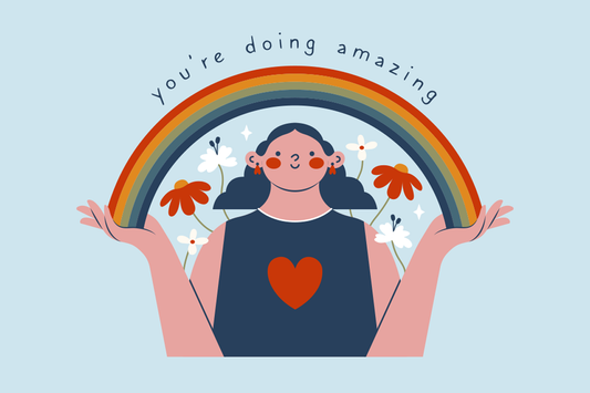 image of a smiling girl holding rainbow in her hands with the words "you're doing amazing" at the top.